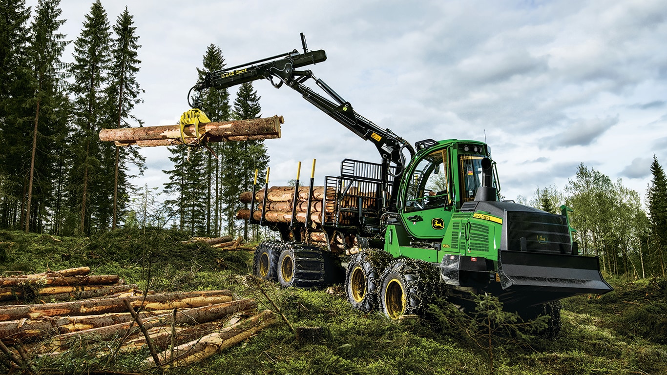 1510g 18.2-metric ton forwarder loading logs on the incline in the forest