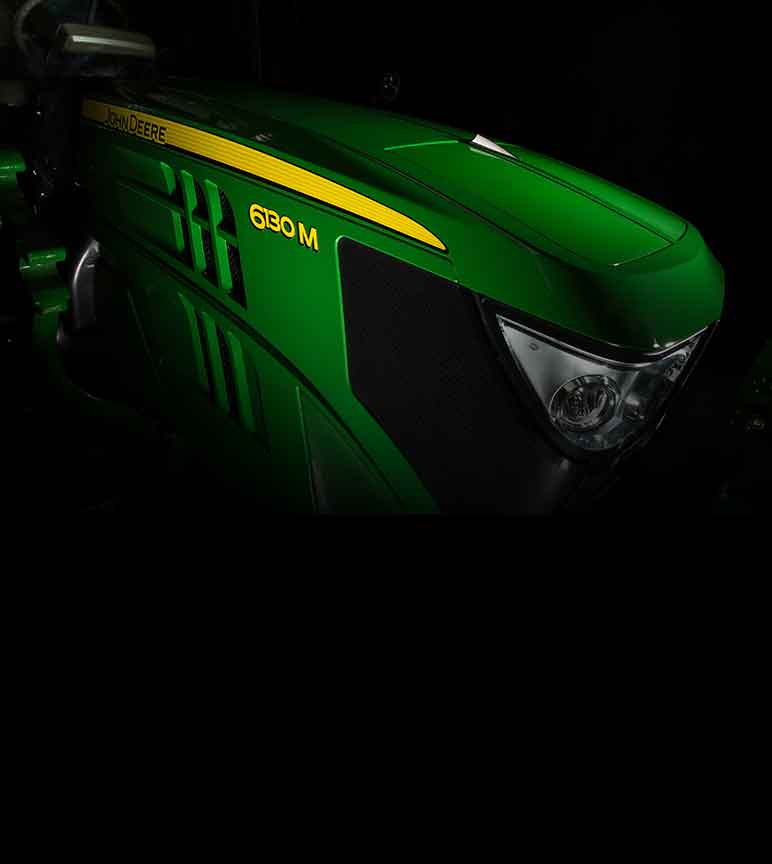 Close up of a John Deere 6130M Tractor hood with spotlight on it