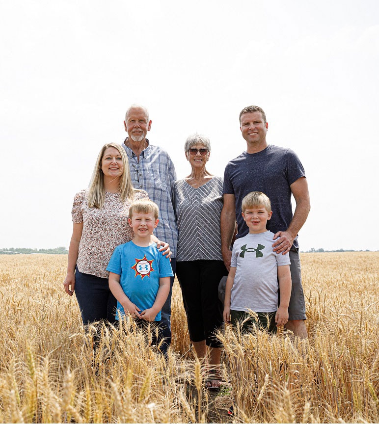 The Pifer family standing together in a field.
