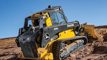 333G Compact Track Loader uses dozer blade to push soil up a hill