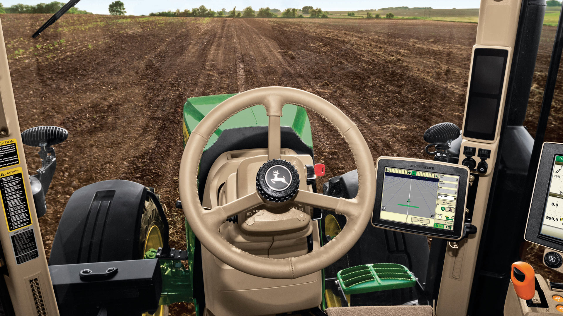 View of a unplanted field from a tractor cab