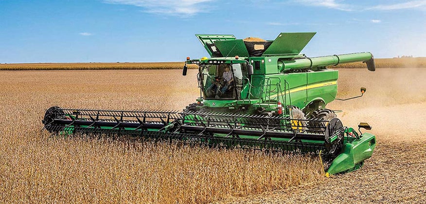 a combine harvesting wheat