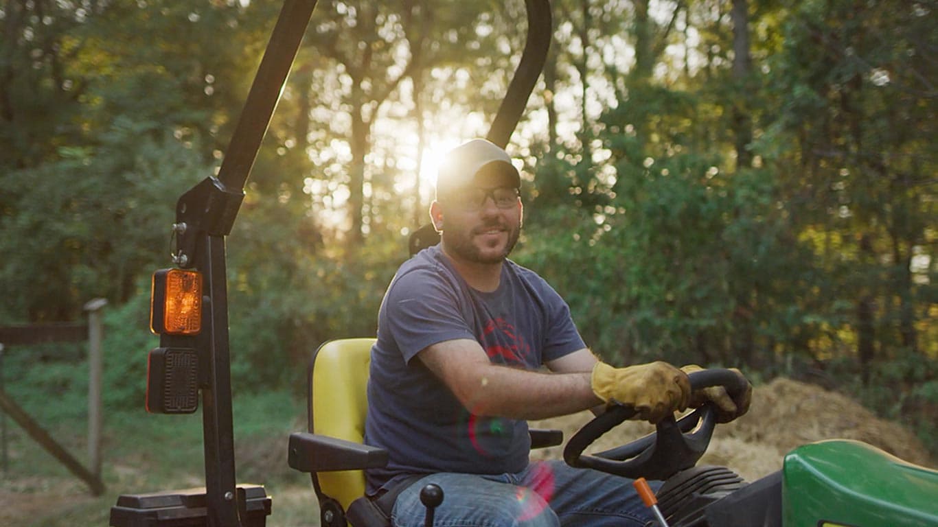 man sitting on a tractor