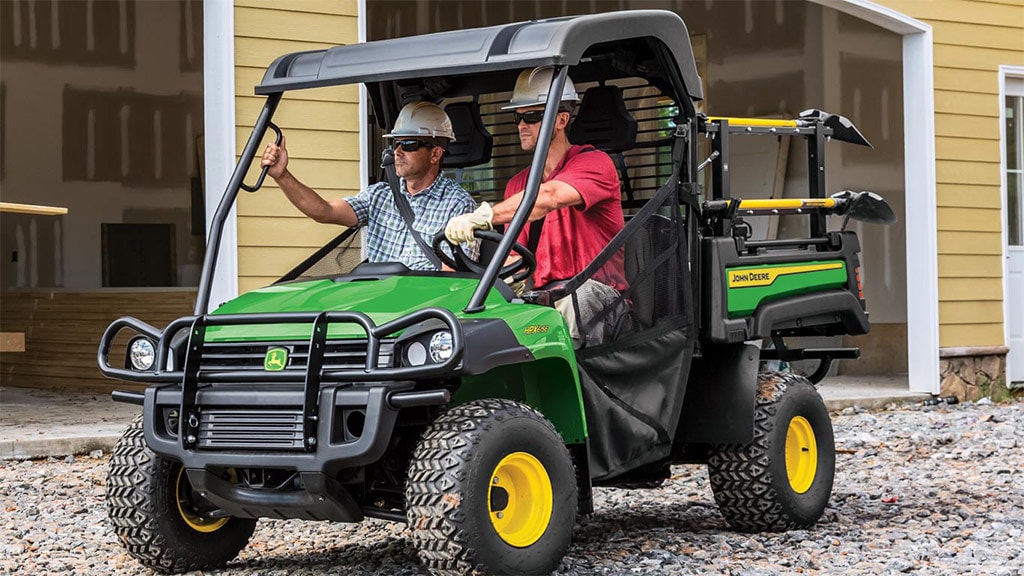 Two men in a HPX615E Work Series Gator