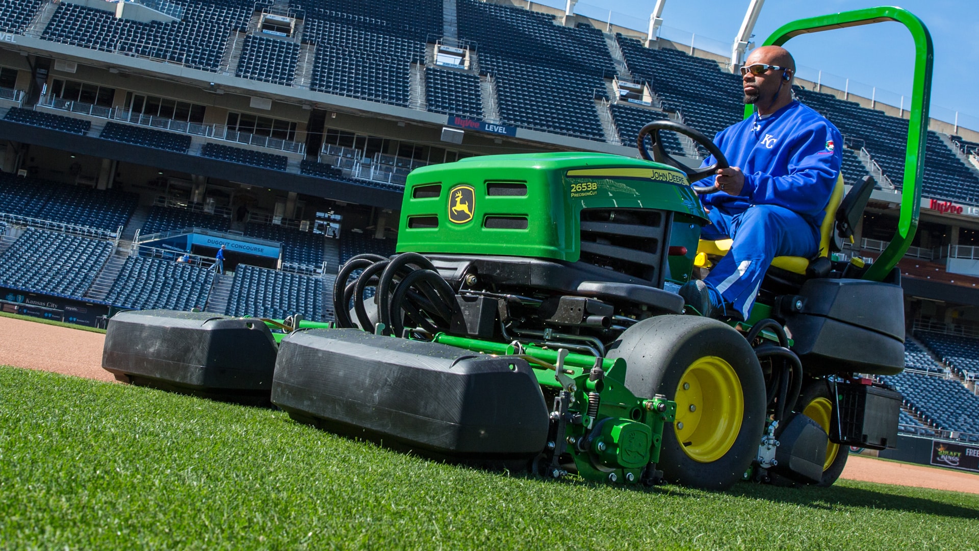 Man cutting grass in a stadium using the 2653B PrecisionCut™ Trim and Surrounds Mower.